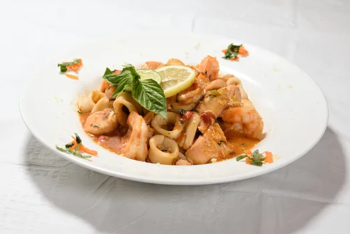Shrimp and calamari over pasta