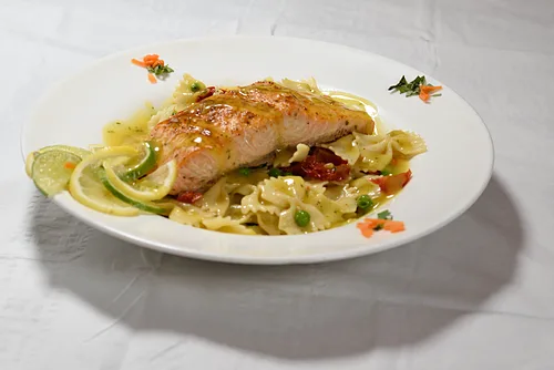 Salmon over bowtie pasta with lemon