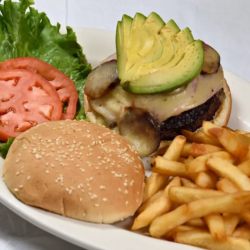 Cheeseburger with avocado and fries
