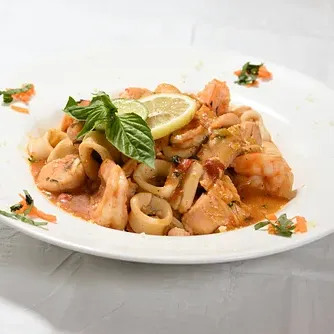 Shrimp and calamari over pasta